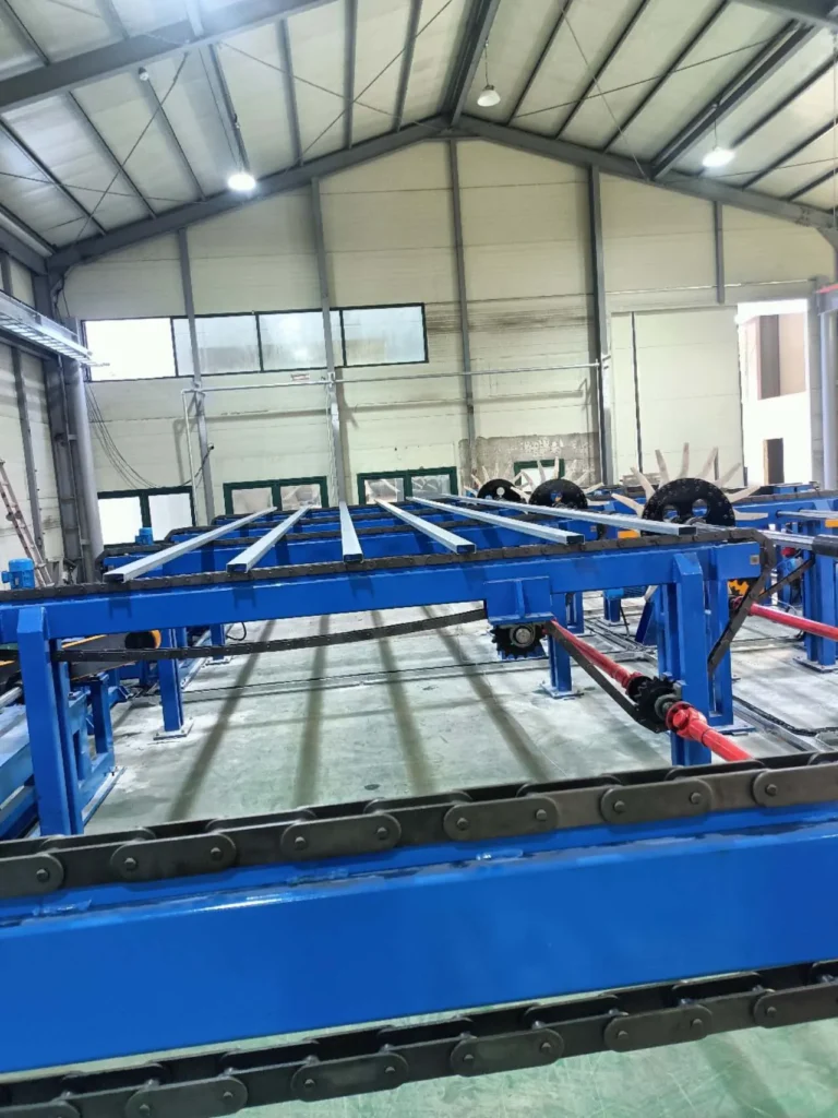 Coating line conveyor running the length of the bay