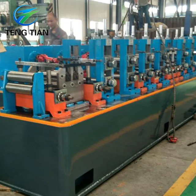 Operator beside the HG32 tube mill line during test running