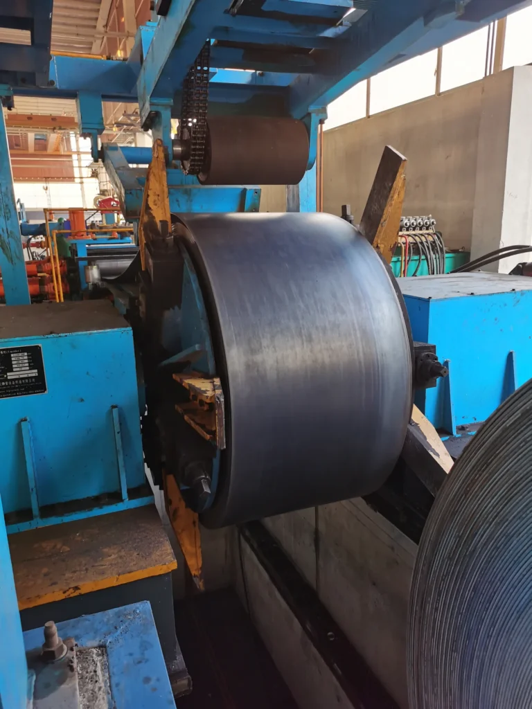 Steel strip entering the HG325 forming section