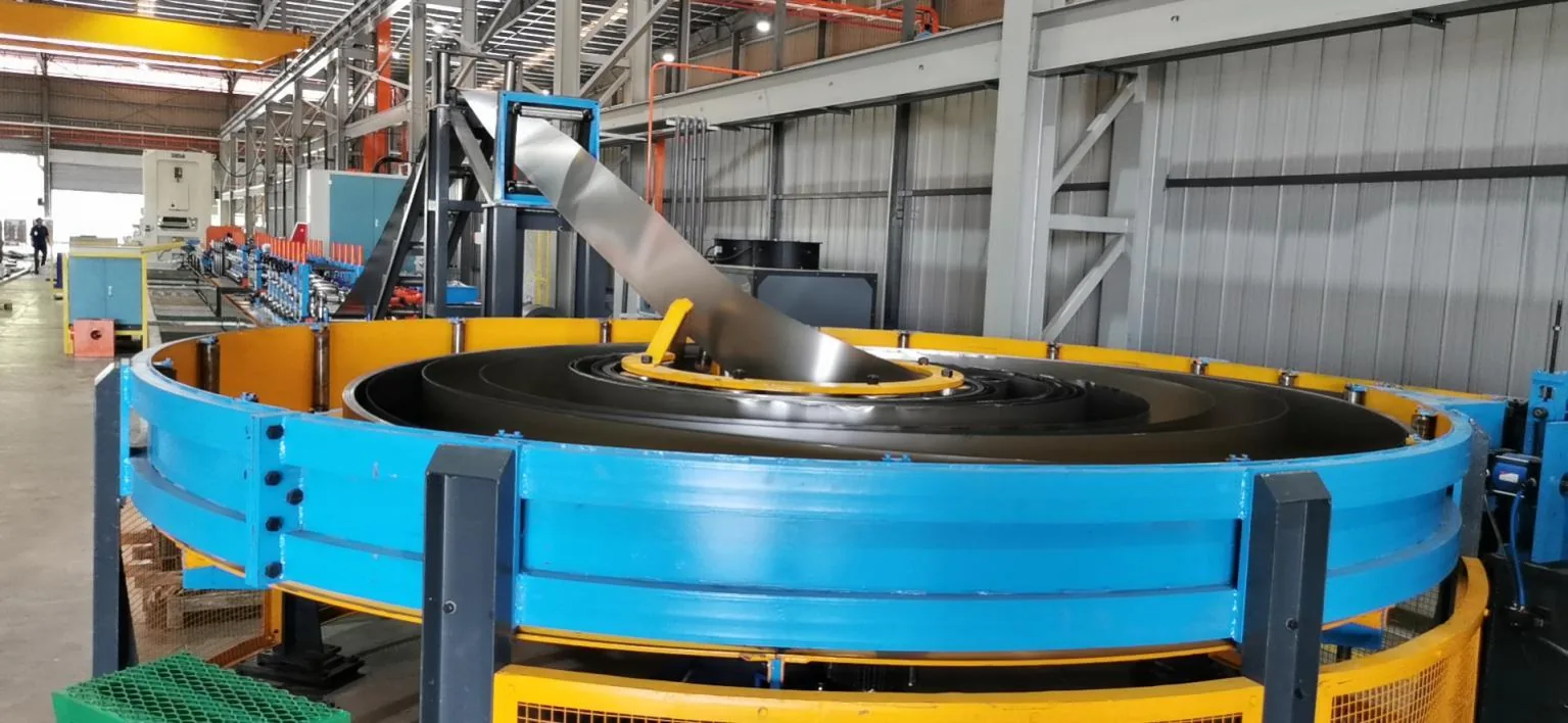 Spiral coil accumulator keeping the mill running through a coil change